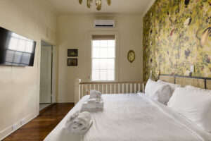 bedroom of speakeasy king suite